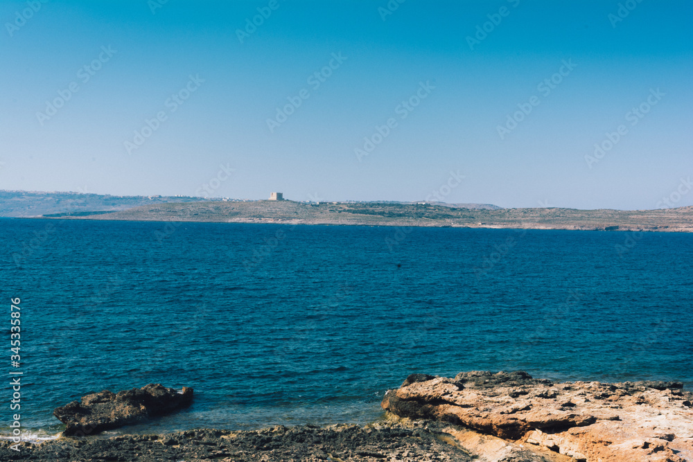 sea and beach view to comino, malta