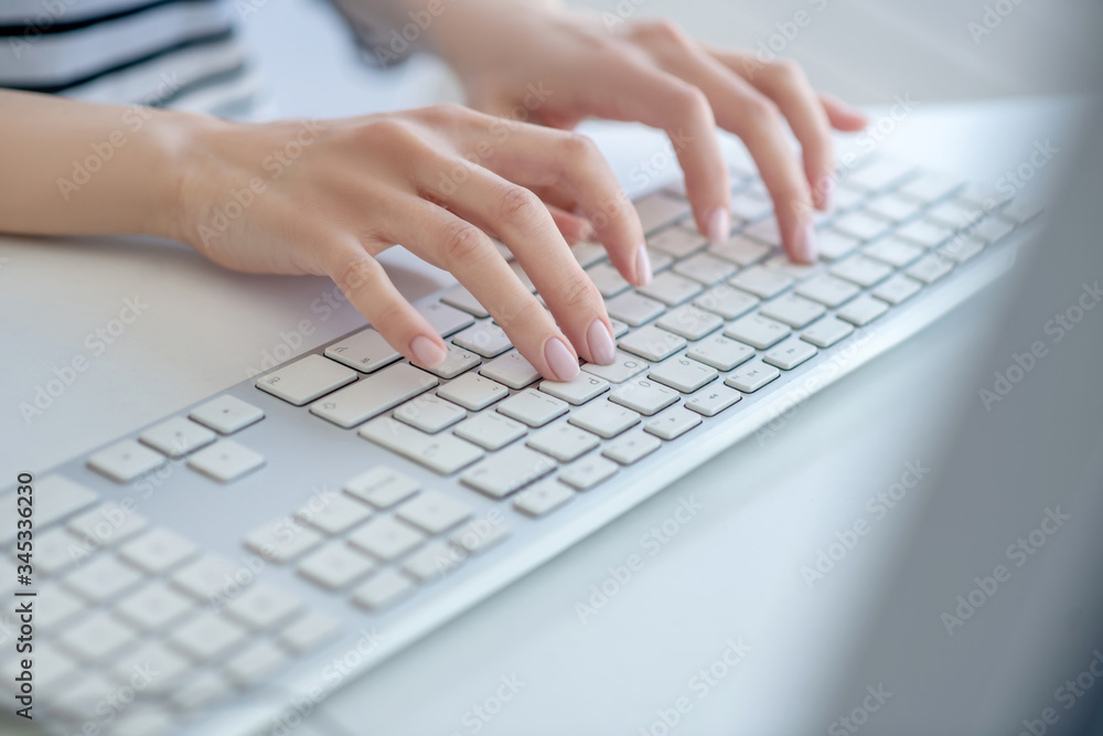 Close up picture of females hands on the keyboard Close up picture of females hands on the keyboard