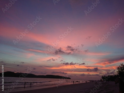 sunset on the beach with violet sky © Steve