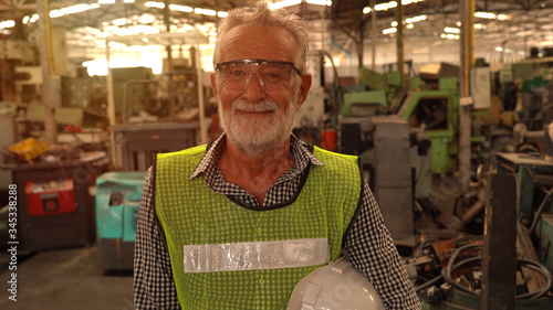 Portrait factory senior man worker