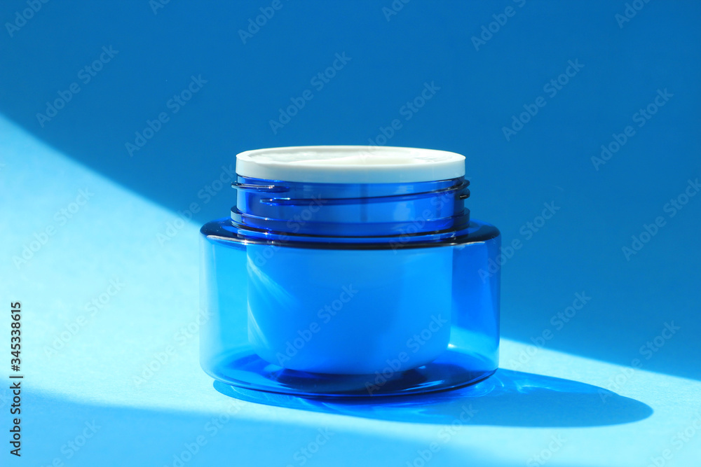 Flat lay face and body cream in a jar. Beauty background with facial cosmetic products. Flat lay face and body cream in a jar. Beauty background with facial cosmetic products.