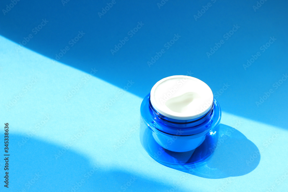 Flat lay face and body cream in a jar. Beauty background with facial cosmetic products. Flat lay face and body cream in a jar. Beauty background with facial cosmetic products.