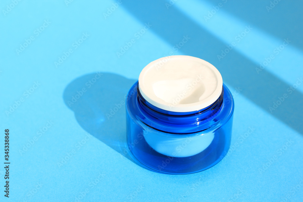 Flat lay face and body cream in a jar. Beauty background with facial cosmetic products. Flat lay face and body cream in a jar. Beauty background with facial cosmetic products.