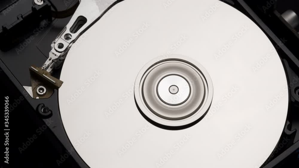 Macro, Close-Up of Computer Hard Disk Drive Spinning and Writing. 4k Macro, Close-Up of Computer Hard Disk Drive Spinning and Writing. 4k