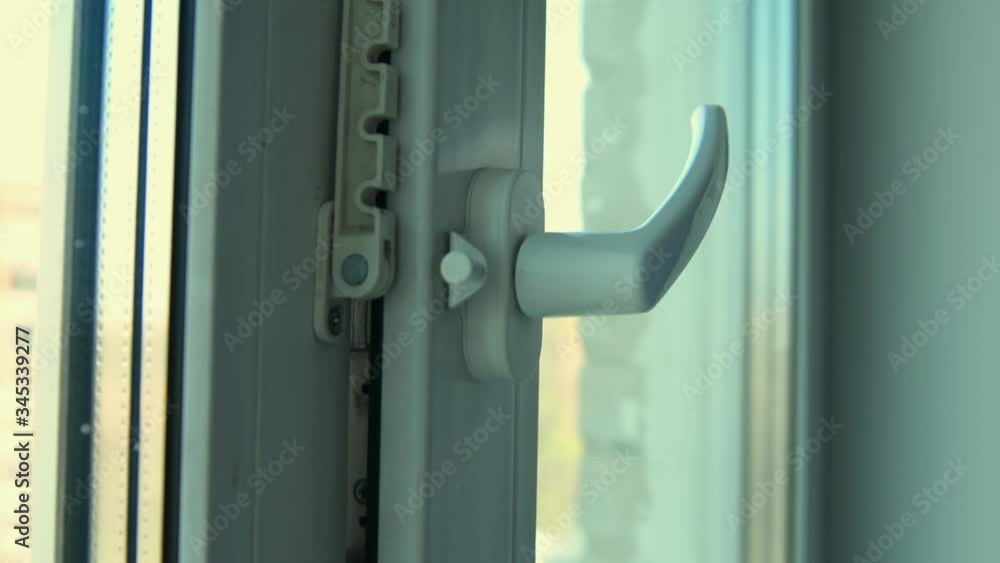 hand in a blue medical glove opens a window into ventilation mode hand in a blue medical glove opens a window into ventilation mode
