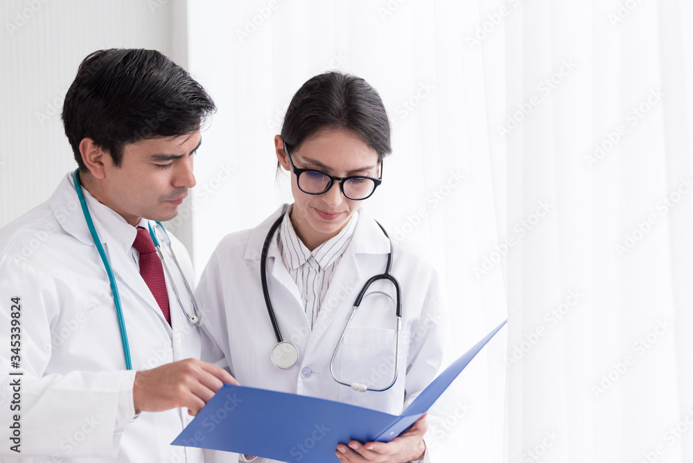 Two doctors have working together with happiness in the hospital. Two doctors have working together with happiness in the hospital.