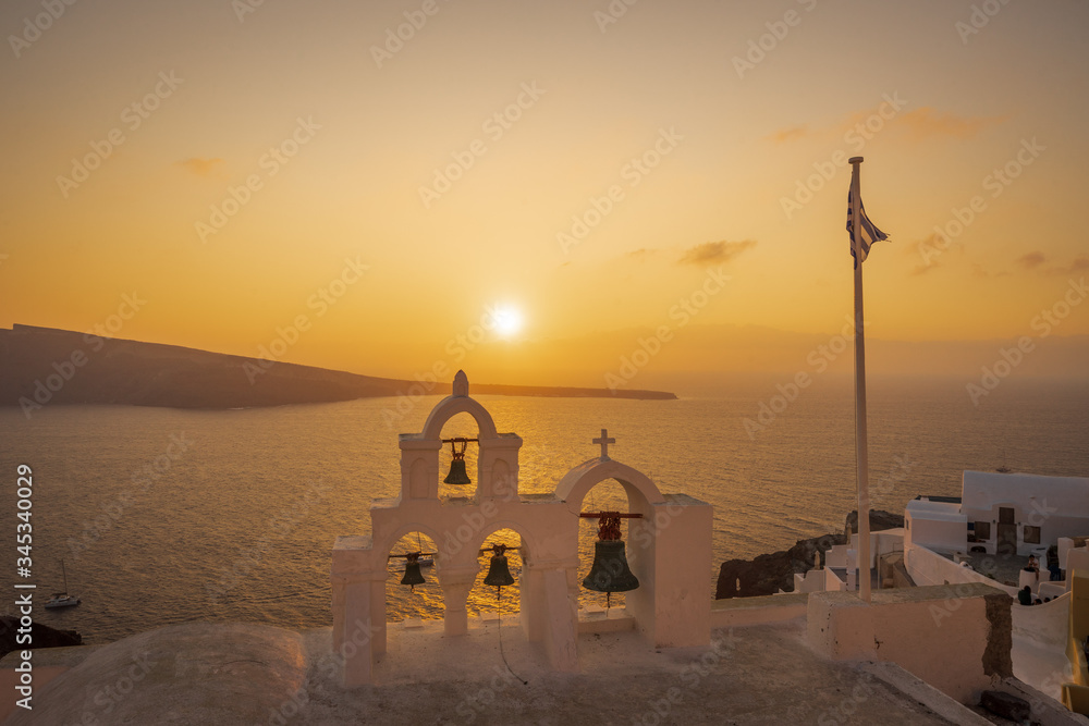 Bell Tower at sunset in Oia, Santorini Island, Cyclades, Greece