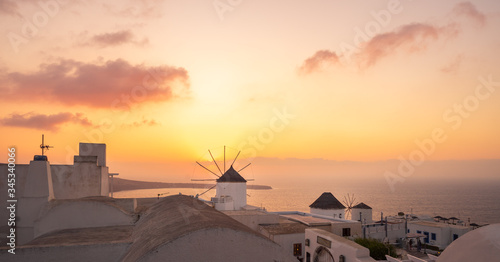 Windmill at sunset in Oia  Santorini Island  Cyclades  Greece