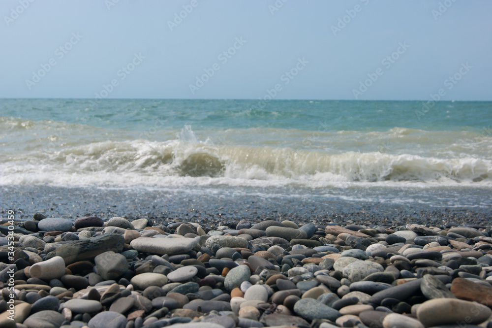 A small storm three or four points at sea, the wave hits the shore with a large pebble. A small storm three or four points at sea, the wave hits the shore with a large pebble.
