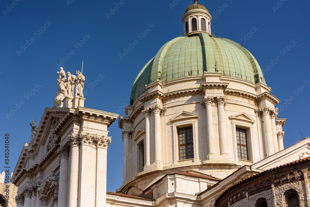 Detail with statues on the facade of the new cathedral, Brescia, Italy.