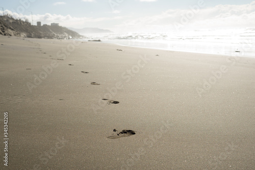 Pacific Ocean sandy beach landscape with footprints California USA