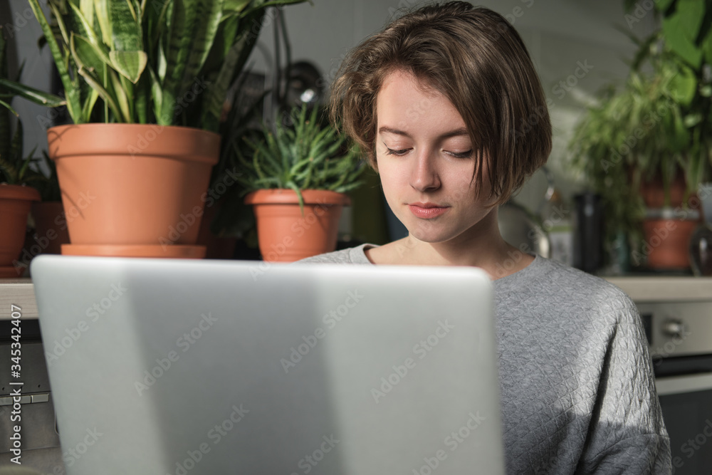 Young freelancer working from home. Freelancer at work at home office during quarantine. Young freelancer working from home. Freelancer at work at home office during quarantine.