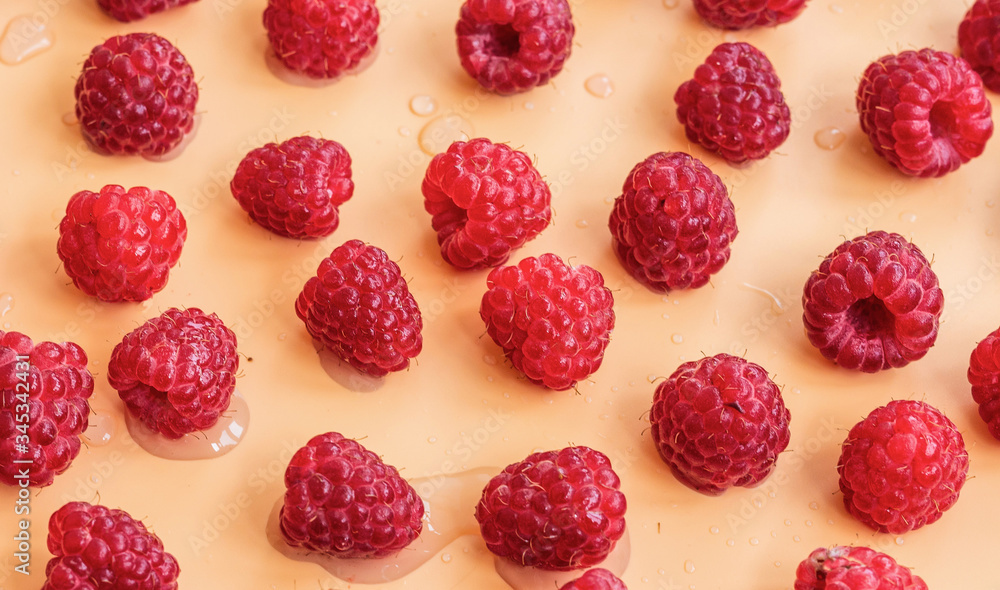 Red raspberries on a yellow background Red raspberries on a yellow background