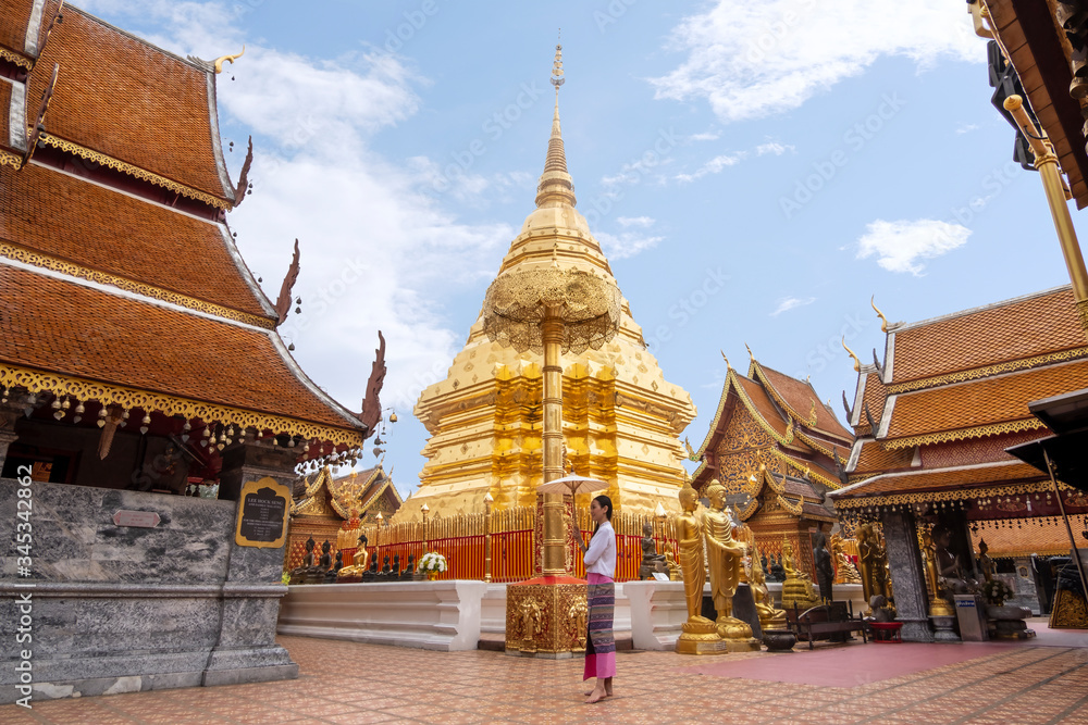 Fototapeta premium Portail of beautiful woman with traditional northern thai dress in temple