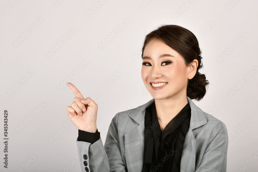 Business asian woman hand finger point presenting product for mock-up advertising, Portrait of happy smiling girl with copy space. Business asian woman hand finger point presenting product for mock-up advertising, Portrait of happy smiling girl with copy space.