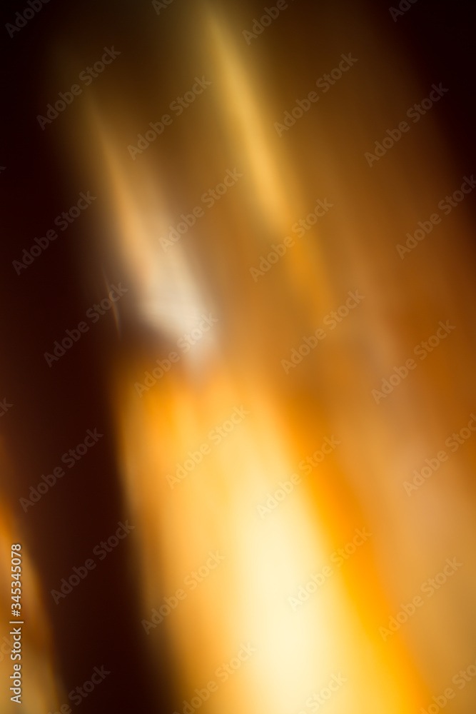 Abstract black background with yellow and orange rays Abstract black background with yellow and orange rays