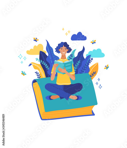 Woman sits on book and holds an open book in her hands