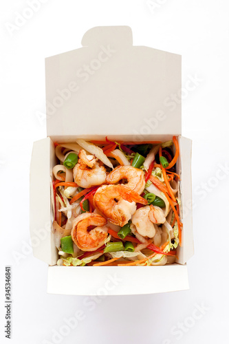 Delicious seafood wok noodles box with shrimps and udon