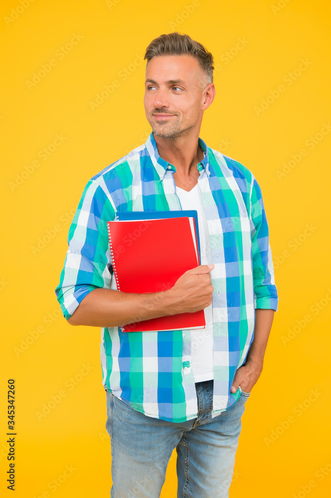 Free courses. Regular student carry workbooks. Student life. Dedicated to studying. Student with textbooks. Keep learning. College university education. Man adult student. Graduation concept Free courses. Regular student carry workbooks. Student life. Dedicated to studying. Student with textbooks. Keep learning. College university education. Man adult student. Graduation concept