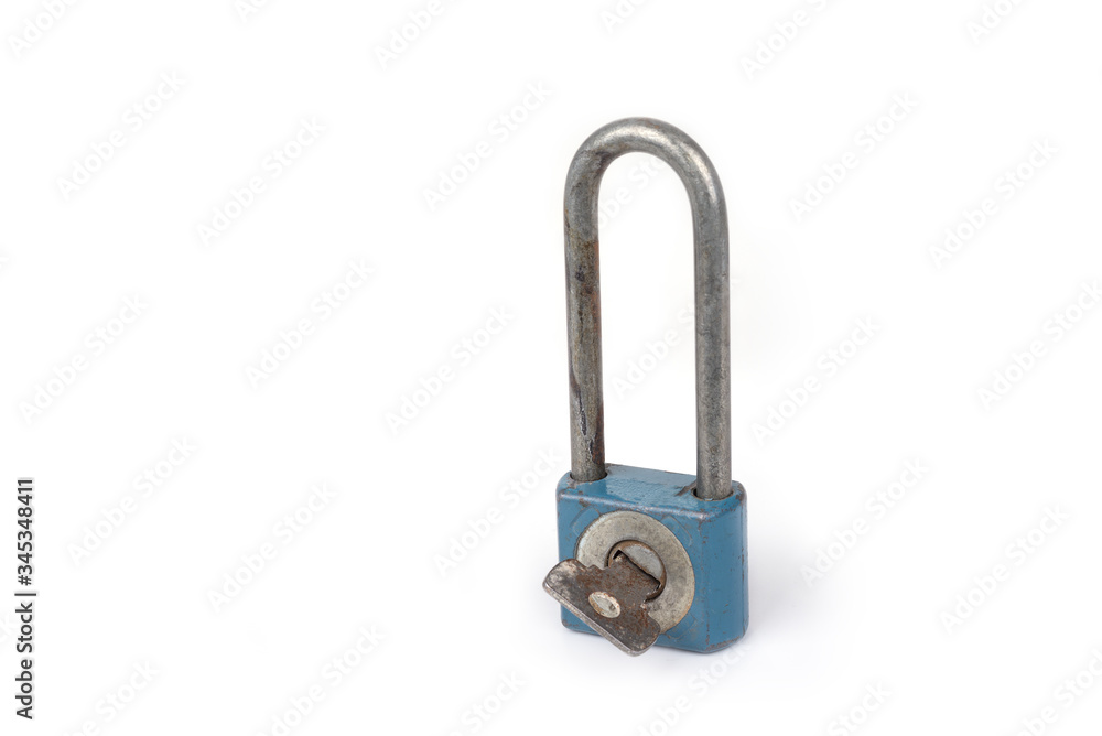 Old long shackle padlock on a white Old long shackle padlock on a white
