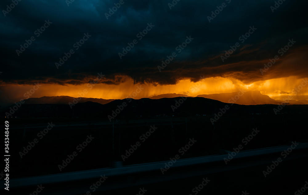 thunderstorm at sunset in the mountains of italy