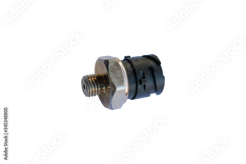 Car oil pressure sensor isolated on white background. Spare parts.