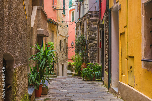 Fototapeta Naklejka Na Ścianę i Meble -  Old medieval street in Italian town Vernazza with nobody on Cinque Terre coast, Liguria, Italy