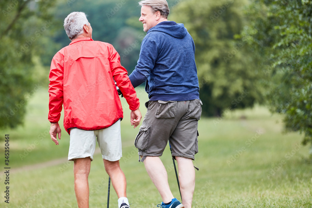 Two seniors together while hiking