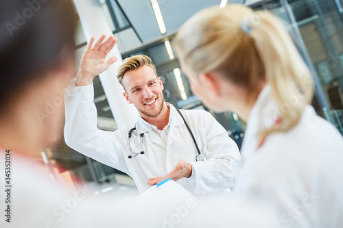   Medicine student in small talk with colleagues