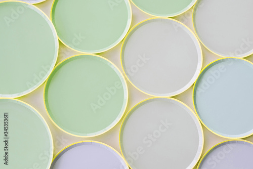 a variety of paper disposable plates of different colors © Mariia