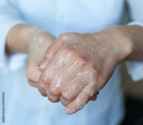 Washing hands. Rubbing with a soap.