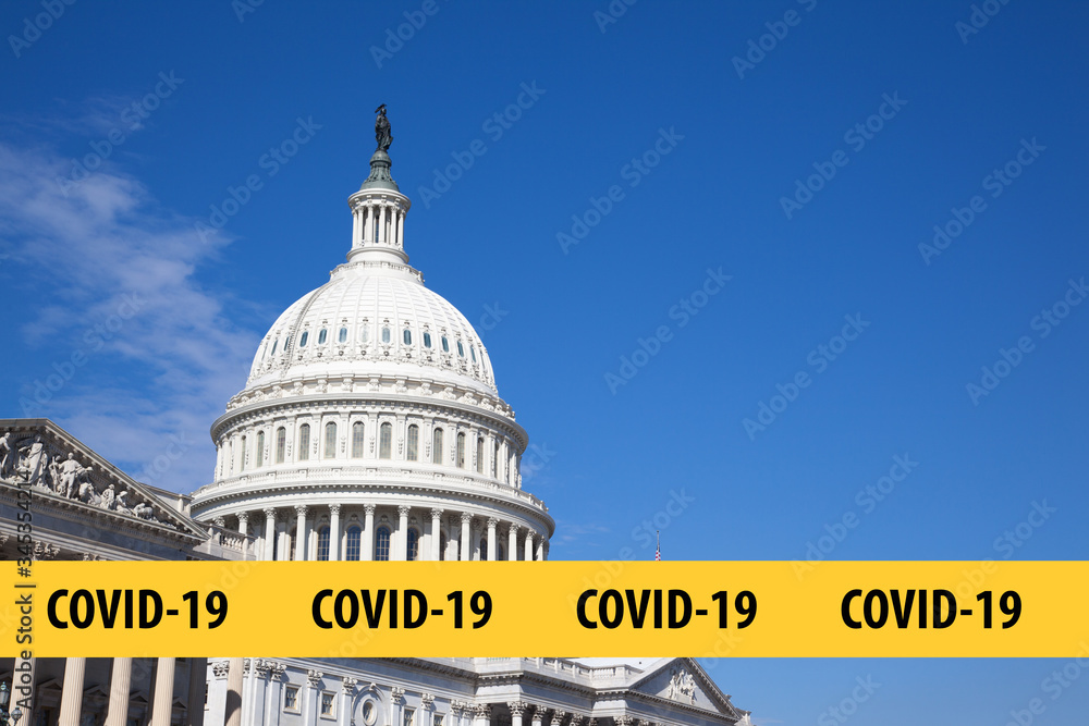 Concept coronavirus Covid-19 is in Washington DC in USA. US Capitol Building is close-up against a blue sky on a sunny day.