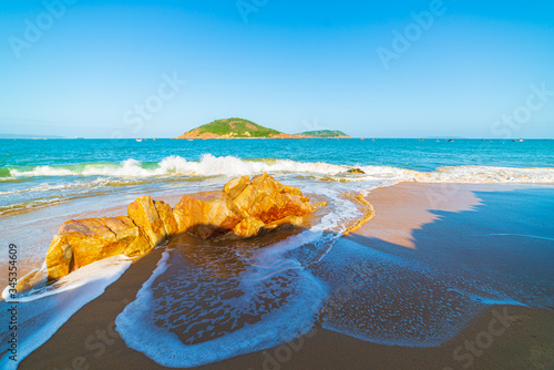 Fototapeta Naklejka Na Ścianę i Meble -  Gorgeous tropical beach turquoise transparent water unique rock boulders, Cam Ranh Nha Trang Vietnam south east coast travel destination, desert beach no people clear blue sky