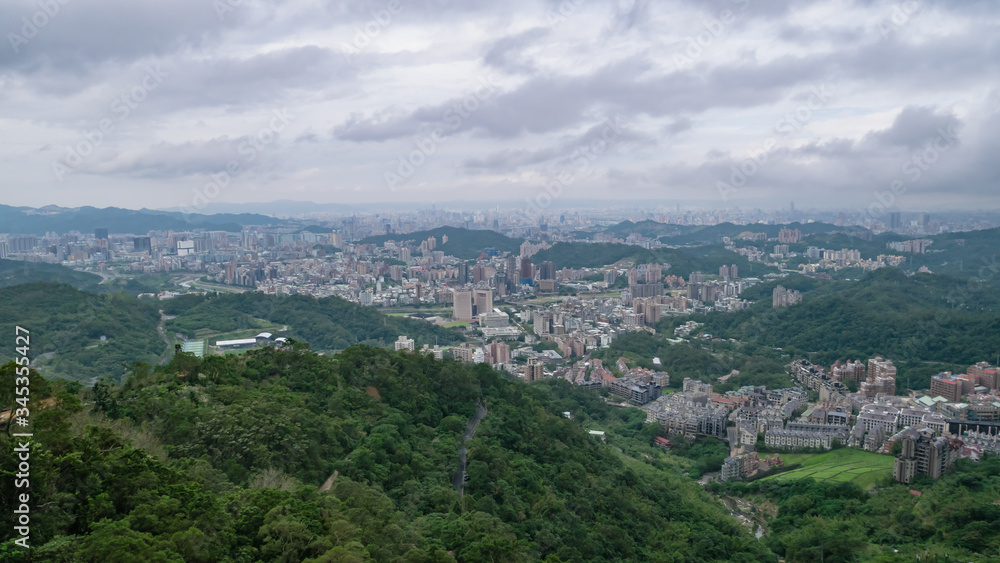 The landscape of building and mountain in Taipei city, Taiwan.