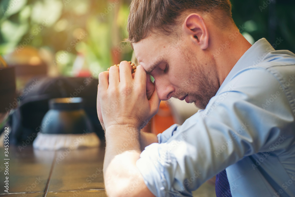 Pray and bible concept.Caucasian men praying,hope for peace and free from coronavirus,Hand in hand together by businessman,believes and faith in christian religion at church. Pray and bible concept.Caucasian men praying,hope for peace and free from coronavirus,Hand in hand together by businessman,believes and faith in christian religion at church.