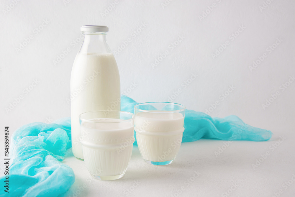 Fermented dairy product kefir drink or yogurt with probiotics on a white background. Fermented dairy product kefir drink or yogurt with probiotics on a white background.