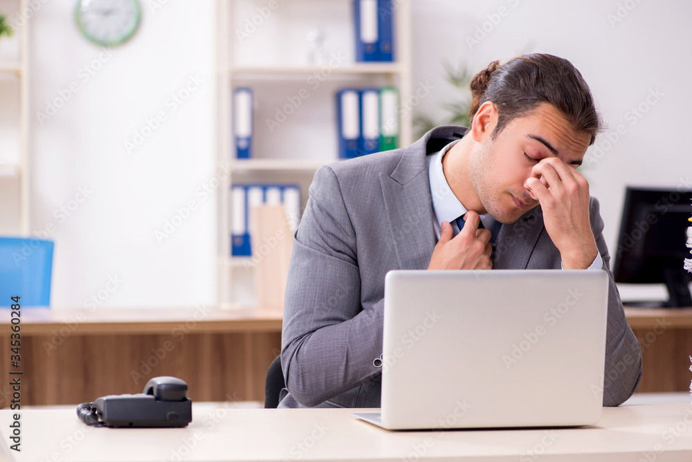 Young male businessman unhappy with excessive work Young male businessman unhappy with excessive work