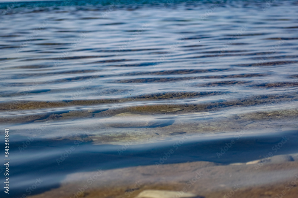 The surface is salty sea water, swaying in small waves near the shore, through the transparent bottom you can see stones and pebbles
The surface is salty sea water, swaying in small waves near the shore, through the transparent bottom you can see stones and pebbles