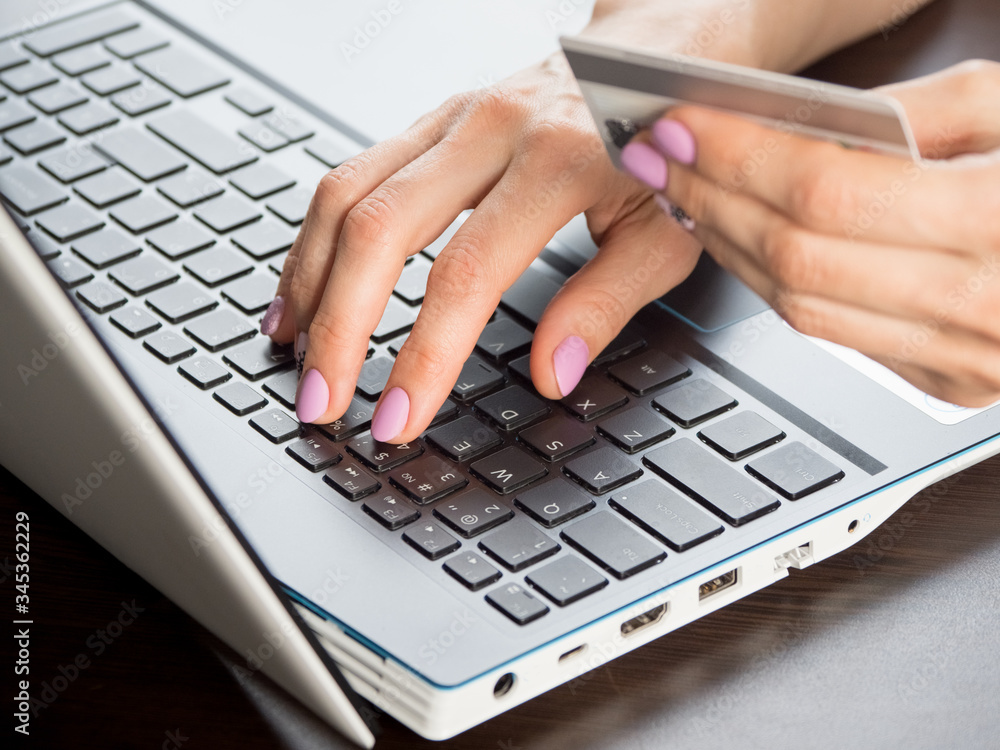 Online payment by using notebook, soft focus, close up Online payment by using notebook, soft focus, close up