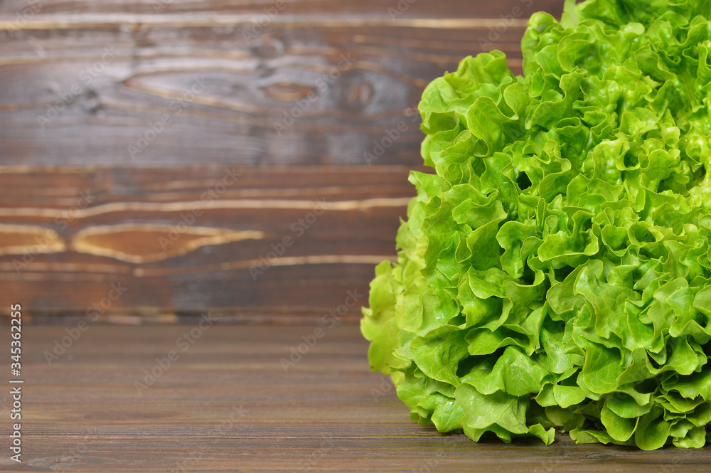 Fresh lettuce on wooden background Fresh lettuce on wooden background