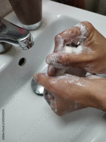 washing hands in bathroom