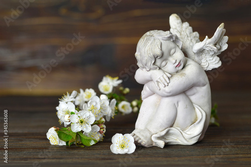 Guardian angel and white spring flowers