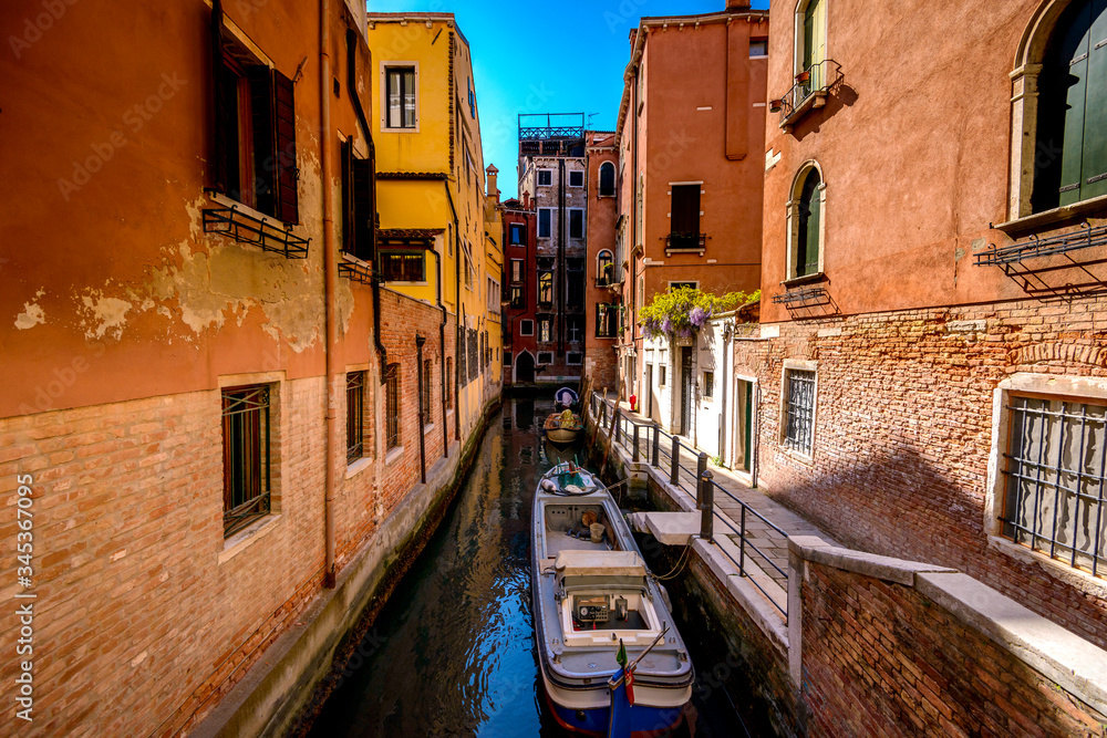Anchored boats on a canal in Venice