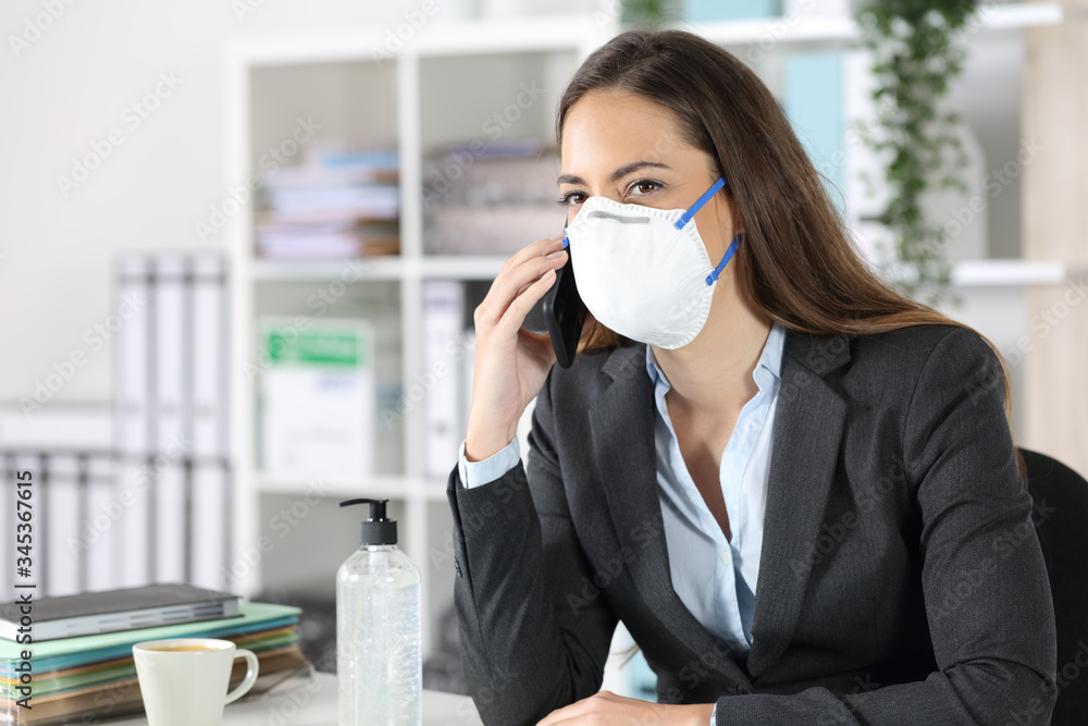 Executive calling on phone avoiding coronavirus at office Executive calling on phone avoiding coronavirus at office