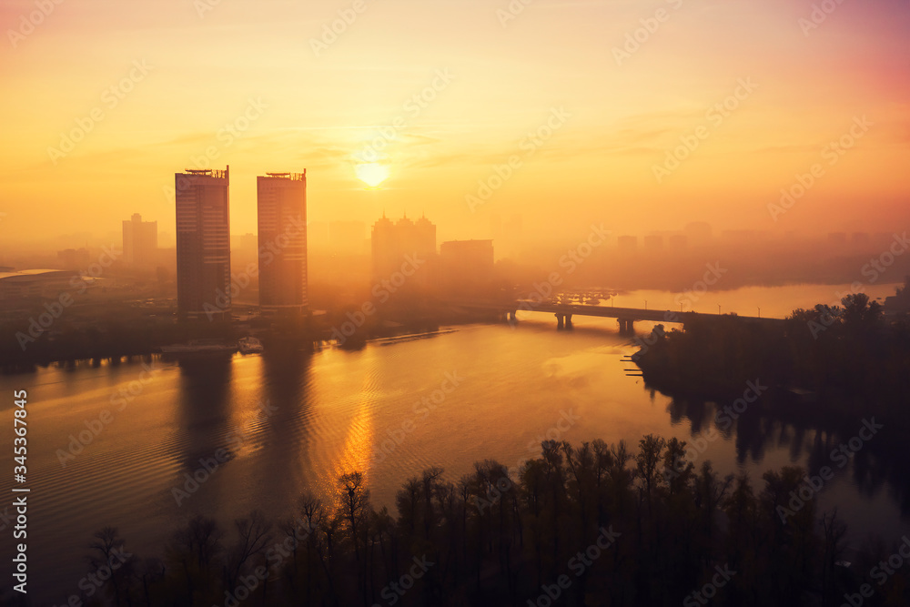 Aerial drone view. View of the Dnieper River in Kyiv on a sunny morning with little fog