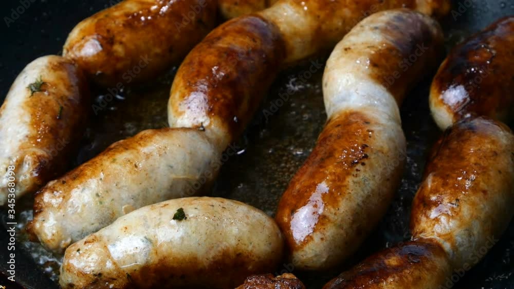 Preparations homemade sausages. Step by step. Pork or chicken meat sausages are fried in hot frying pan in boiling vegetable or olive oil. Home fast food. Close up. Preparations homemade sausages. Step by step. Pork or chicken meat sausages are fried in hot frying pan in boiling vegetable or olive oil. Home fast food. Close up.