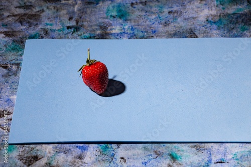 red strawberry on a blue background
