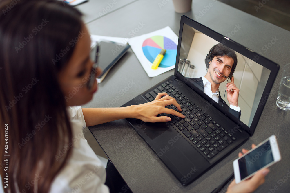 Businessman is working in remote with a videocall due to quarantine of coronavirus covid19. Concept of smart working Businessman is working in remote with a videocall due to quarantine of coronavirus covid19. Concept of smart working
