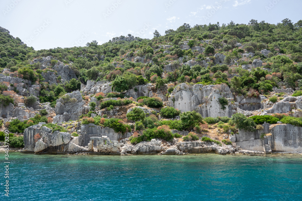 Ruins of sunken ancient city of Dolichiste on the northern part of the Kekova Island. Devastating earthquake in the 2nd century AD