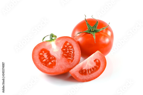 Whole Fresh tomato and half tomatoes on white background.